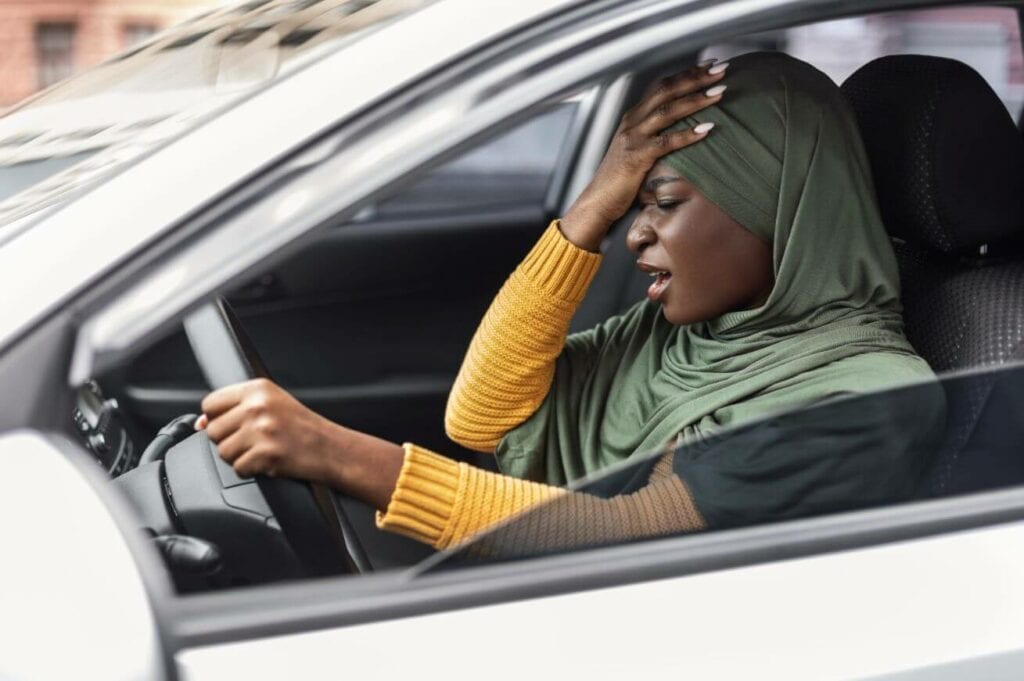 driving-anxiety-stressed-black-muslim-lady-in-hija-U38CK7M